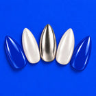 Brainwave press-on nails fanned out on cobalt: cobalt, pearly white and silver almond nails.