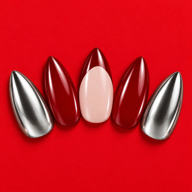 Diet Cherry press-on nails fanned out on red: deep red, silver, and blush with a red tip.