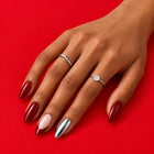 A hand on red wearing Diet Cherry: deep red, silver, and blush with a red tip.