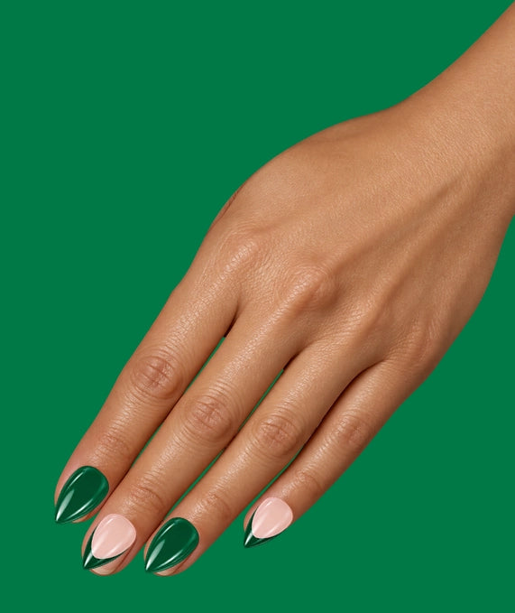 Illustration: a hand on emerald wearing the Green Flag set: emerald nails and blush nails with green tips.